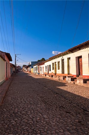 Buildings on Cobblestone street, Trinidad, Cuba, West Indies, Caribbean Stock Photo - Premium Royalty-Free, Code: 600-07487313