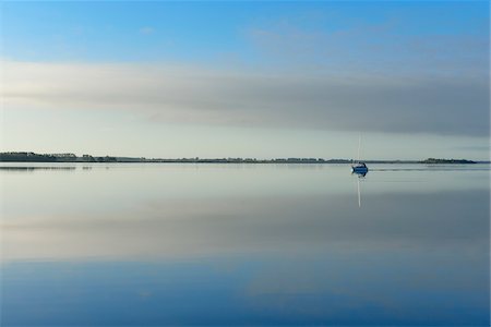 simsearch:600-07487558,k - Calm Water with Sail Boat, Born aauf dem Darss, Barther Bodden, Fischland-Darss-Zingst, Mecklenburg-Vorpommern, Germany Stock Photo - Premium Royalty-Free, Code: 600-07487552