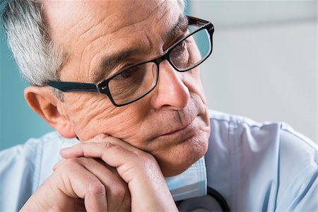 doctor portraits - Close-up of Doctor leaning on hands Stock Photo - Premium Royalty-Free, Code: 600-07487605