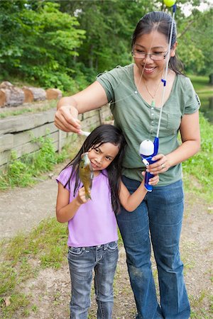 Portrait of woman with fishing gear Stock Photos - Page 1 : Masterfile