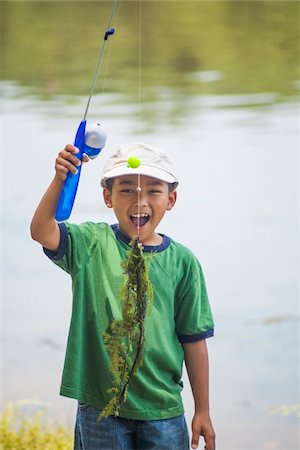 Boy with Fishing Line full of Pondweed, Lake Fairfax, Reston, Virginia, USA Foto de stock - Sin royalties Premium, Código: 600-07529190