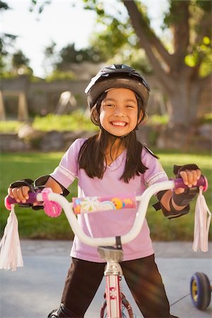 female biker - Portrait of Girl Riding Bike with Safety Gear, Utah, USA Stock Photo - Premium Royalty-Free, Code: 600-07529200