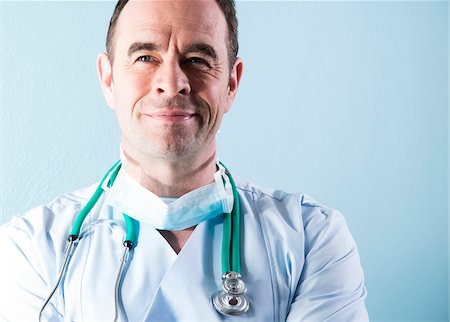 smiling doctor with lab coat - Portrait of Mature Doctor, Mannheim, Baden-Wurttemberg, Germany Stock Photo - Premium Royalty-Free, Code: 600-07541343