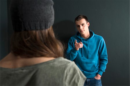 Teenage Girl and Young Man Arguing, Studio Shot Stock Photo - Premium Royalty-Free, Code: 600-07562441