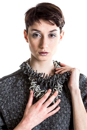 fashion model accessory - Portrait of Young Woman wearing Modern Jewellery, Studio Shot Stock Photo - Premium Royalty-Free, Code: 600-07596034