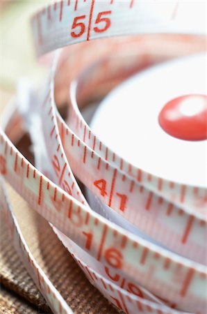 pollice - Close-up of Flexible Measuring Tape Fotografie stock - Premium Royalty-Free, Codice: 600-07637016