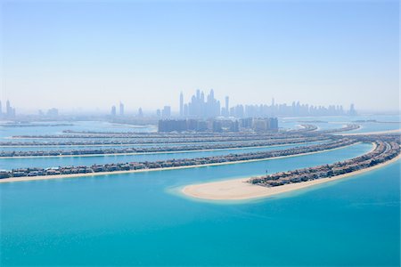 skyscraper dubai - Aerial View of Palm Jumeirah with Skyscrapers in background, Dubai, United Arab Emirates Stock Photo - Premium Royalty-Free, Code: 600-07653877