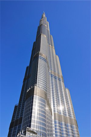 simsearch:600-07653873,k - Looking up Sun Reflecting off Burj Khalifa with Blue Sky, Dubai, United Arab Emirates Stock Photo - Premium Royalty-Free, Code: 600-07653872