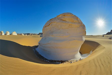 Rock Formations and Sun in White Desert, Libyan Desert, Sahara Desert, New Valley Governorate, Egypt Stock Photo - Premium Royalty-Free, Code: 600-07689529