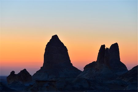 egypt and desert - Silhouette of Rock Formations at Dawn in White Desert, Libyan Desert, Sahara Desert, New Valley Governorate, Egypt Stock Photo - Premium Royalty-Free, Code: 600-07689534