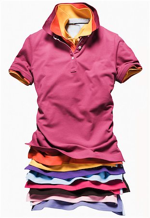 Many Layers of Colorful Polo Shirts on White Background Stock Photo - Premium Royalty-Free, Code: 600-07708375