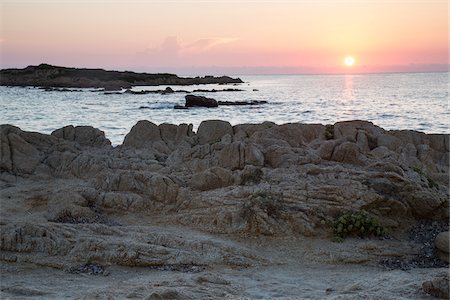 sonrisa sardónica - Beach at sunrise, Capo Comino, Siniscola, Nuoro Province, Sardinia, Italy Stock Photo - Premium Royalty-Free, Code: 600-07769845