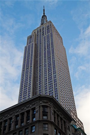 simsearch:600-07653873,k - Looking up at Empire State Building, Midtown Manhattan, New York City, New York, USA Stock Photo - Premium Royalty-Free, Code: 600-07760283