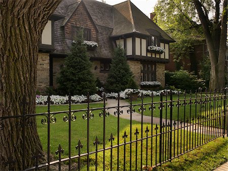 exterior home summer - View of iron fence and house exterior in summer, Toronto, Ontario, Canada Stock Photo - Premium Royalty-Free, Code: 600-07803129