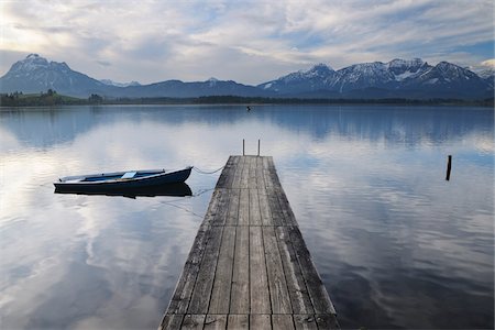 Wooden Jetty with Rowboat, Hopfen am See, Lake Hopfensee, Bavaria, Germany Stock Photo - Premium Royalty-Free, Code: 600-07844555