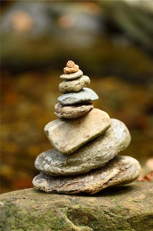 Close-up of a small cairn next to a river in autumn, Bavarian Forest National Park, Bavaria, Germany Stock Photo - Premium Royalty-Free, Code: 600-07911218