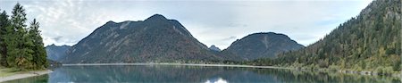 Scenic view of mountains and a clear lake (Plansee) in autumn, Tirol, Austria Stock Photo - Premium Royalty-Free, Code: 600-07911254