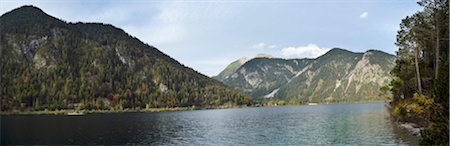 Scenic view of mountains and a clear lake (Plansee) in autumn, Tirol, Austria Stock Photo - Premium Royalty-Free, Code: 600-07911253