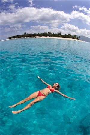 fondo (fotografía) - Woman floating in the Caribbean Sea at Little Jost Van Dyke in the British Virgin Islands, Caribbean Foto de stock - Sin royalties Premium, Código: 600-07945070