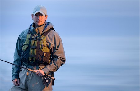 pole - Portrait of a man while fishing on the rocks along the coast of Rhode Island, USA Stock Photo - Premium Royalty-Free, Code: 600-07945085