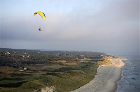 A powered Paraglider over the beach near Gay Head on Martha's Vineyard, Massachusetts, USA Stock Photo - Premium Royalty-Free, Code: 600-07945117