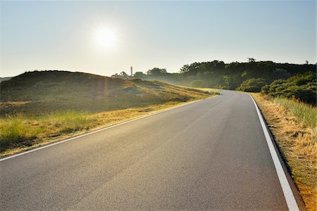 european roads not people not lifestyle not illustration - Country Road with Sun in Summer, Norderney, East Frisia Island, North Sea, Lower Saxony, Germany Photographie de stock - Premium Libres de Droits, Code: 600-07945241