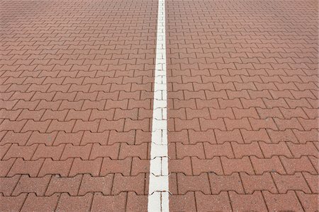 Close-up of road with interlocking brick stones and white line, Norderney, East Frisia Island, North Sea, Lower Saxony, Germany Stockbilder - Premium RF Lizenzfrei, Bildnummer: 600-07945264