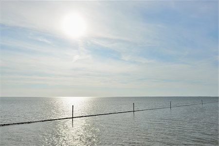 seawall - North Sea with Sun in Summer, Norderney, East Frisia Island, North Sea, Lower Saxony, Germany Foto de stock - Sin royalties Premium, Código: 600-07945350