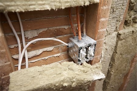 peter reali - Light Switch Junction Box and Insulation in Home Under Renovation Foto de stock - Royalty Free Premium, Número: 600-07958218