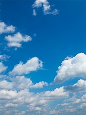 puffy clouds - Puffy Clouds in Blue Sky Stock Photo - Premium Royalty-Free, Code: 600-07965877