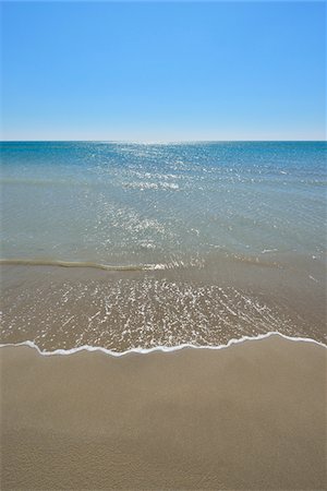 Sandy Beach in Summer, Mediterranean Sea, Saintes-Maries-de-la-Mer, Camargue, Bouches-du-Rhone, Provence-Alpes-Cote d'Azur, France Stock Photo - Premium Royalty-Free, Code: 600-07968221