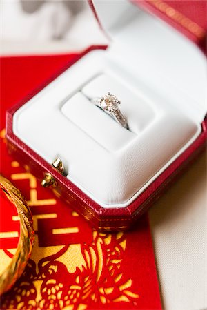 engagement ring - Close-up of Diamond Ring and Ang Pow, Studio Shot Stock Photo - Premium Royalty-Free, Code: 600-07991474