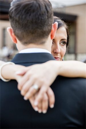 Portrait of Bride and Groom Hugging Outdoors, Hamilton, Ontario, Canada Stock Photo - Premium Royalty-Free, Code: 600-07991601
