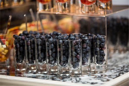 Close-up of Blueberries in Shot Glasses on Dessert Table Stock Photo - Premium Royalty-Free, Code: 600-07991656