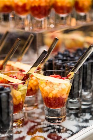 Close-up of Glasses of Fruit Cocktail and Shot Glasses of Blueberries on Dessert Table Stock Photo - Premium Royalty-Free, Code: 600-07991663