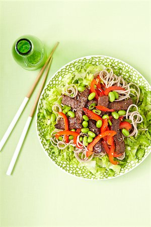 simsearch:600-07156143,k - Beef strips, Soba Noodles, Edamame and Red Peppers, with Chopsticks, studio shot on green background Stock Photo - Premium Royalty-Free, Code: 600-08002082