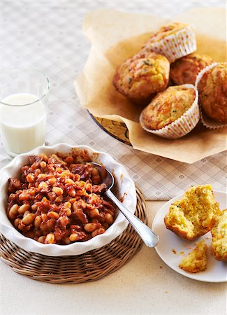 Baked beans and cornbread muffins with a glass of milk, studio shot Stock Photo - Premium Royalty-Free, Code: 600-08002135