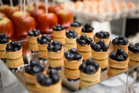 simsearch:600-05756453,k - Close-up of dessert platters with blueberry tarts, at an event, Canada Stock Photo - Premium Royalty-Free, Code: 600-08002533