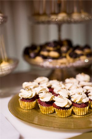 Close-up of Red Velvet Cupcakes on Dessert Table Stock Photo - Premium Royalty-Free, Code: 600-08025961