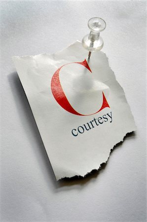 Close-up of Torn Page with C and Courtesy on it, Pinned to Board Stock Photo - Premium Royalty-Free, Code: 600-08026128