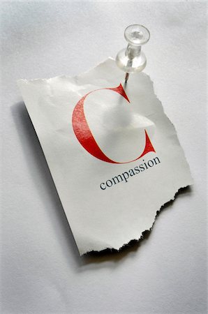 spiegazzato - Close-up of Torn Page with C and Compassion on it, Pinned to Board Fotografie stock - Premium Royalty-Free, Codice: 600-08026129