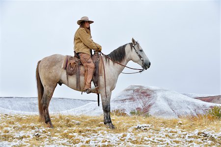 simsearch:841-05960428,k - Cowgirl Riding Horse in Snow, Rocky Mountains, Wyoming, USA Stock Photo - Premium Royalty-Free, Code: 600-08026185