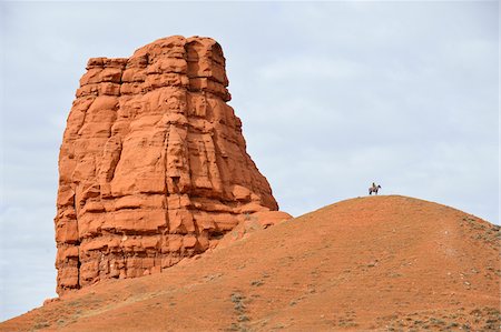 free fall - Cowboy Riding Horse in the distance, Castel Rock, Wyoming, USA Stock Photo - Premium Royalty-Free, Code: 600-08082915
