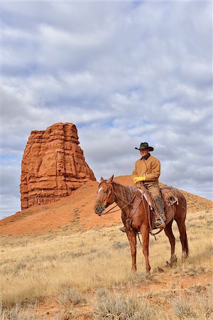 simsearch:841-05960428,k - Cowboy Riding Horse with Castel Rock in the background, Shell, Wyoming, USA Stock Photo - Premium Royalty-Free, Code: 600-08082919