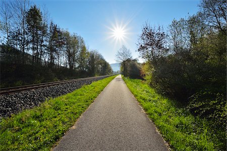 simsearch:600-08232289,k - Cycle Path with Sun in Spring, Faulbach, Churfranken, Spessart, Miltenberg-District, Bavaria, Germany Stock Photo - Premium Royalty-Free, Code: 600-08232267