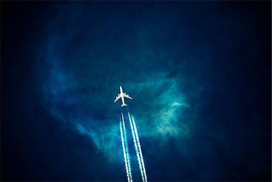 Commercial Airplane with Contrails in Dark Sky Stock Photo - Premium Royalty-Free, Artist: Douglas E. Walker, Image code: 600-08280335
