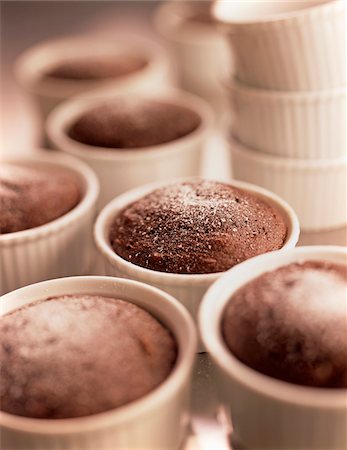 Close-up of Chocolate Cakelettes and Ramekins on Kitchen Counter, Studio Shot Stock Photo - Premium Royalty-Free, Code: 600-08312047