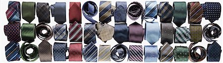 simsearch:600-03698079,k - Assortment of ties rolled-up on white background in studio Foto de stock - Sin royalties Premium, Código: 600-08312068