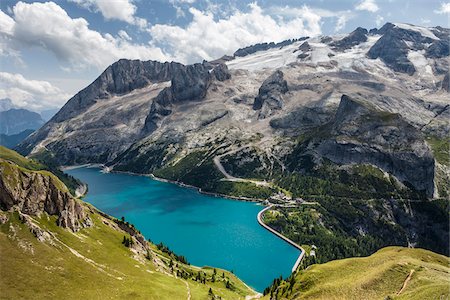 Scenic overview of Lake Fedaia, just at the foot of Marmolada, the Queen of Dolomites, on the border between Trentino Alto Adige and Veneto, Italy Stock Photo - Premium Royalty-Free, Code: 600-08386016