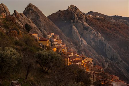 simsearch:600-08416771,k - Scenic view of the sandstone rocks and mountain village of Castelmezzano at sunset, Lucanian Dolomites, Basilicata, Italy Stock Photo - Premium Royalty-Free, Code: 600-08416768